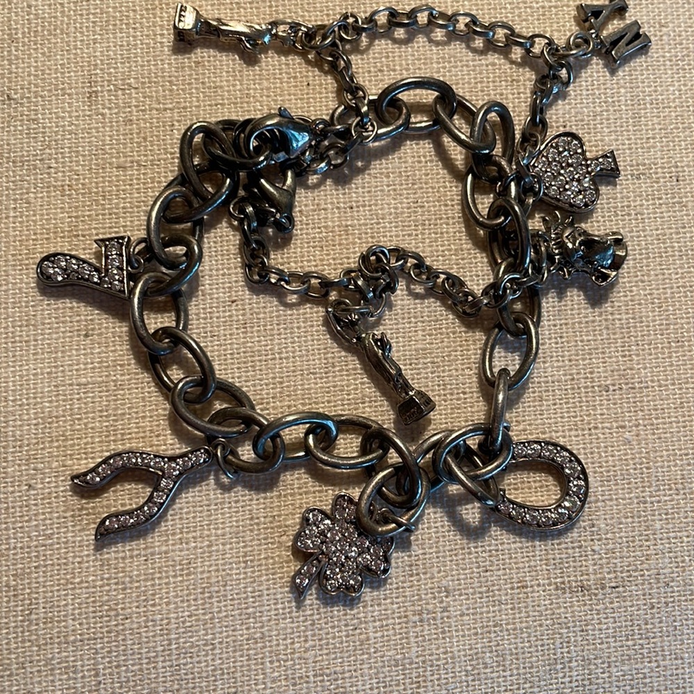 Lucky Brand bracelet with dimel acccents and claw closure burnish silver color